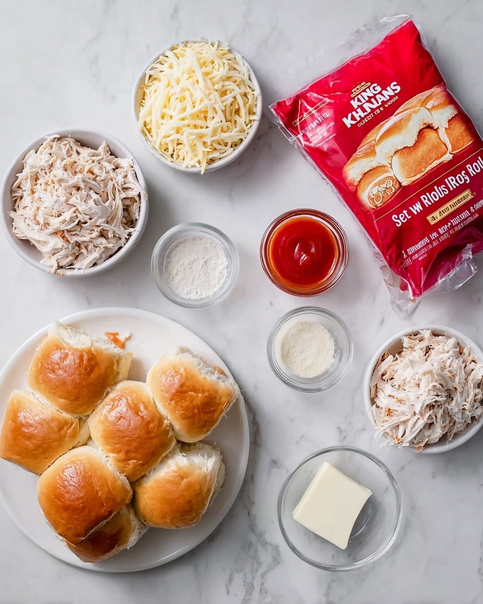 The image shows ingredients for a dish neatly arranged on a white marbled surface. There are small white bowls containing shredded chicken that is pale with light brown bits on top, two bowls of shredded cheese that is light yellow and white in color, and three small white bowls with creamy and powdery white sauces or spices. A small white square of butter is next to these bowls. A clear container holds bright red hot sauce, and next to all the ingredients is a bright red bag of King's Hawaiian Original Hawaiian Sweet Rolls, filled with soft, golden-brown rolls. The layout is clean and organized, ready for cooking. Photo taken with an iphone --ar 4:5 --v 7