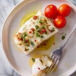 Oven-Baked Cod with Cherry Tomatoes, Lemon, and Herbs Recipe