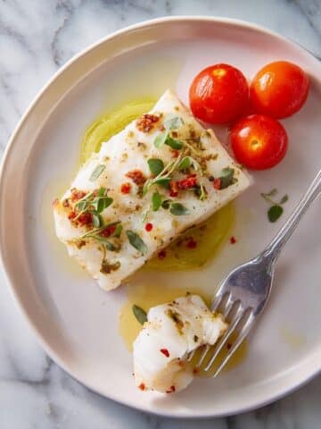 Oven-Baked Cod with Cherry Tomatoes, Lemon, and Herbs Recipe