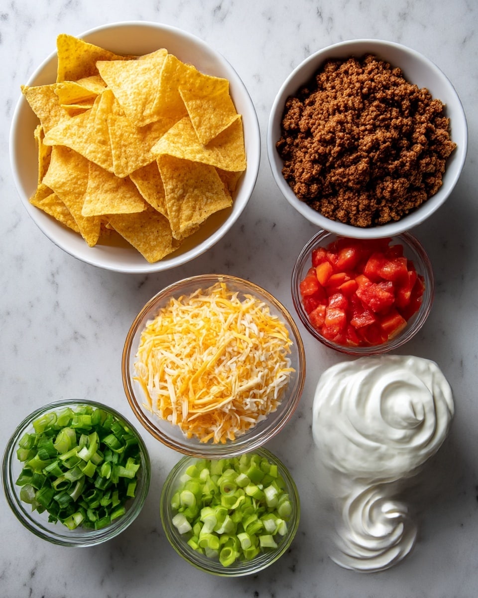 The image shows six bowls arranged on a white marbled surface, each holding a different ingredient. Starting from the top left, there is a white bowl filled with yellow tortilla chips that have a rough texture and irregular shapes. Next to it on the right is a white bowl with cooked ground beef, showing a crumbly, dark brown texture. Below the tortilla chips is a small clear bowl filled with bright red, diced tomatoes. At the center bottom is a bowl with shredded yellow and white cheese, presenting a soft, fine texture. To the right of the cheese, there is another small clear bowl filled with sliced green onions, showing a fresh, light green and white color. At the bottom left is a white bowl containing chopped darker green onions with a slightly glossy look. Finally, at the bottom right, there is a clear bowl filled with smooth, white sour cream with swirls on top. The photo taken with an iphone --ar 4:5 --v 7
