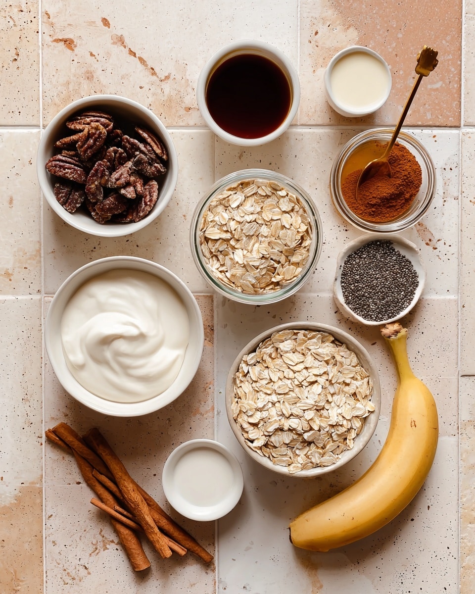 A group of small white bowls and a cup sit on a white marbled texture surface with beige and light brown tiles. One bowl holds dark brown pecans with rough texture, another has light brown rolled oats with a dry, flat look. A white bowl contains smooth, creamy white Greek yogurt. There is a small white cup filled with dark honey and another white cup with light milk. A small white dish holds tiny chia seeds, appearing black and shiny. A glass jar with cinnamon powder shows a rich, reddish-brown color with a golden spoon inside. Two cinnamon sticks lie beside the jar. A peeled banana with a yellow outer peel and light inner fruit rests on the surface. A small white bowl contains dark vanilla extract. The items are arranged with space between them, and a woman's hand is not visible in the image. Photo taken with an iphone --ar 4:5 --v 7