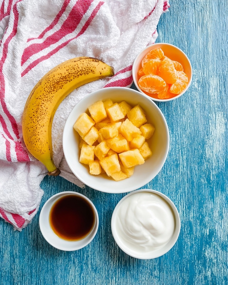The image shows four white bowls placed on a white marbled surface with a red and white striped cloth partly visible at the top. The largest bowl in the center contains small cubed pieces of frozen yellow-orange mango. Above it, a smaller bowl contains four orange slices arranged in a circular way with their bright orange, juicy texture visible. To the bottom right, there is a bowl filled with smooth white yogurt. To the bottom left, another bowl holds a small amount of dark liquid, likely vanilla or syrup. A ripe banana with brown spots lies next to the mango bowl on the left side. The photo taken with an iphone --ar 4:5 --v 7